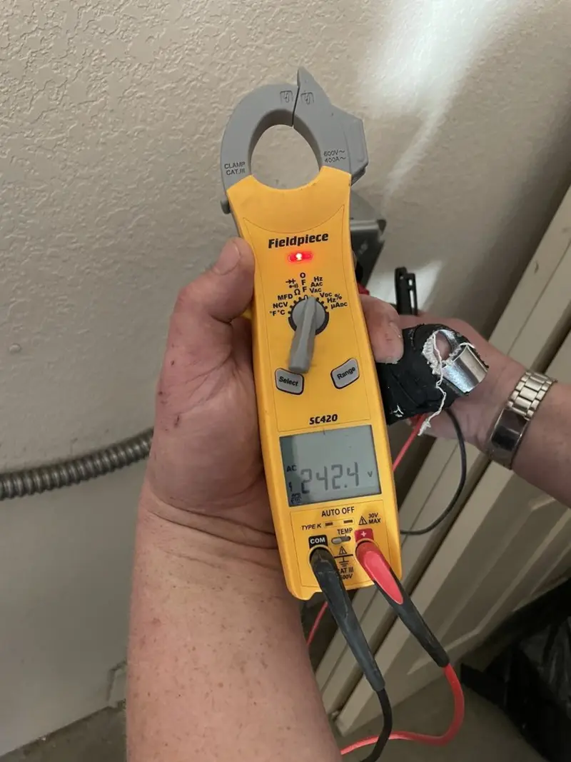Voltage testing with clamp meter during Electrical Installation Services in Simsbury